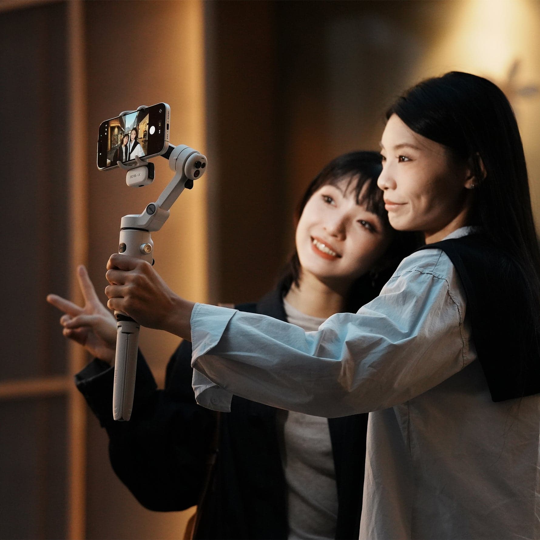 Young creators filming a video together with a smartphone